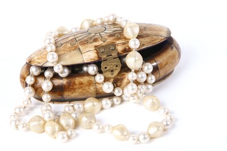 Small casket with pearls on white backgroundの写真素材
