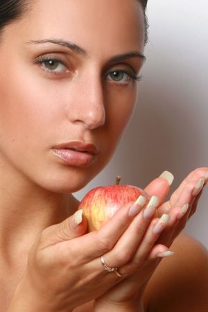Beautiful girl holding apple の写真素材