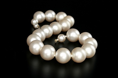 Beads from pearls, on a black backgroundの写真素材