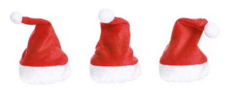 Three Christmas Santa Hat isolated on white backgroundの写真素材