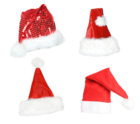 Christmas and xmas red hats, isolated on white backgroundの写真素材