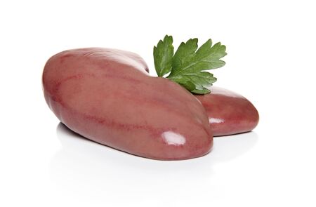 Pork kidneys with parsley leaf on white backgroundの写真素材