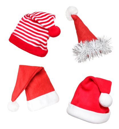 Santa red hats, isolated on white backgroundの写真素材
