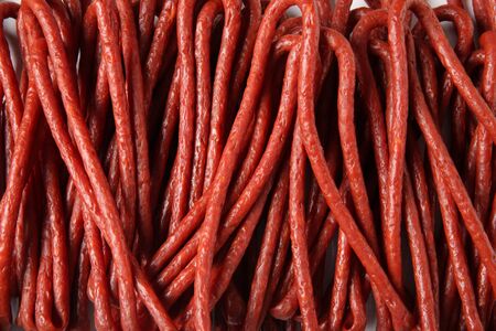 Kabanos. Polish long thin smoked pork sausages, backgroundの写真素材