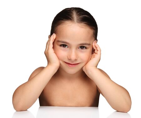 Portrait of a beautiful young girl on white backgroundの写真素材