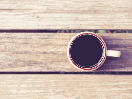 Coffee cup on Wooden background Vintage Hipster styleの写真素材