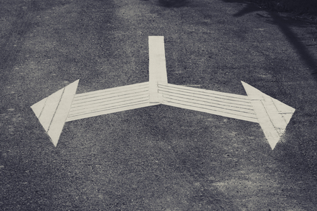 Arrow Sign direction on road Left and Right Traffic Signage outdoorの写真素材