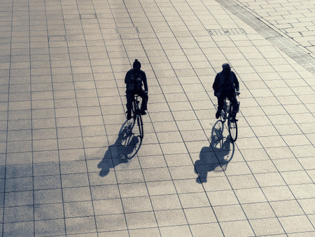Silhouette men on bicycle outdoor Street Urban lifestyleの写真素材