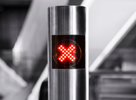 No entry sign cross digital light on stainless pole