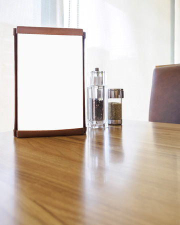 Mock up menu frame on Table in restaurant cafe shopの写真素材