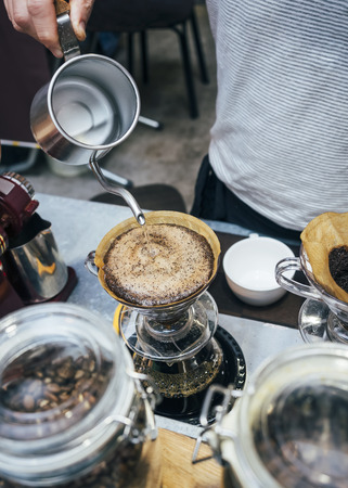 Barista pouring water on Drip coffee Brewing techniqueの写真素材