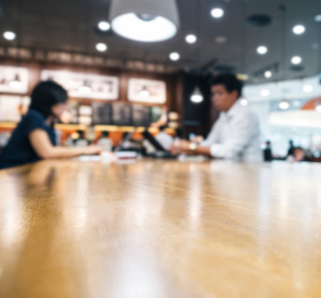 Table top with blurred people in cafe restaurant backgroundの写真素材