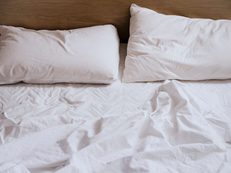 Bed Mattress and pillows unmade