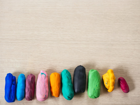 Colorful Clays on wooden Blank board templateの写真素材