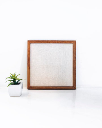 Blank Wooden frame with small Green plant succulent Hipster style decoration