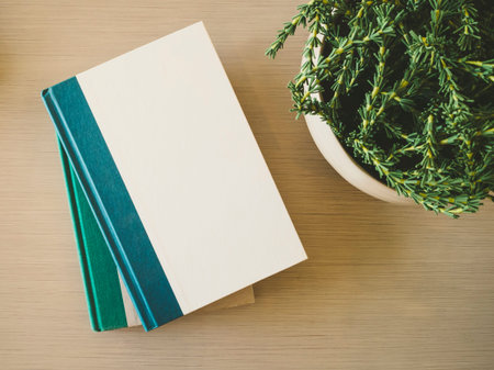 Book cover Mock up template on table with plant decorationの写真素材