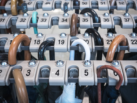 Umbrella Locker in rows with numbers Public service の写真素材