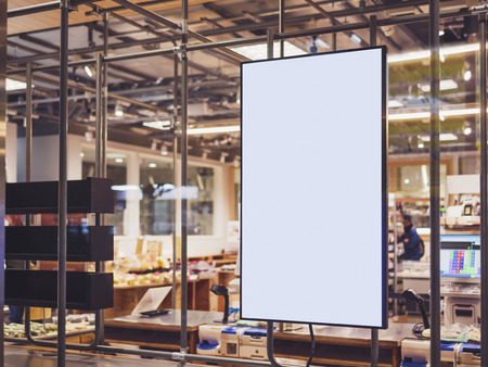 Blank Poster frame template in Supermarket blur People Advertising bannerの写真素材