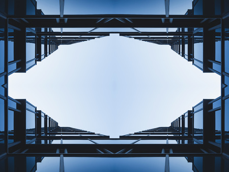Architecture detail Glass facade Reflection Modern building exterior symmetry patternの写真素材