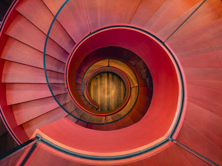 Spiral staircase Modern Architecture detail Red colour Abstract Backgroundの写真素材