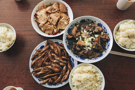 Chinese food local meal tofu fried fish meat with rice Home cook style Table top viewの写真素材