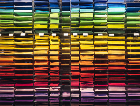 Colourful paper on shelf Stationary shop letter paper and envelopeの写真素材