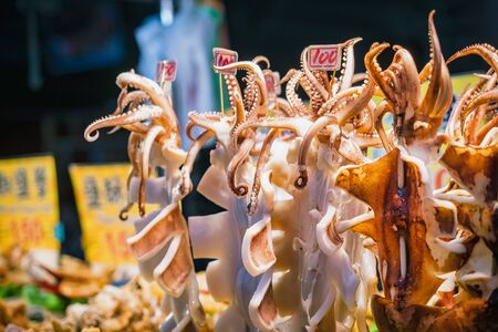 Giant Squid bbq grilled Street food sell at Taiwan night marketの写真素材