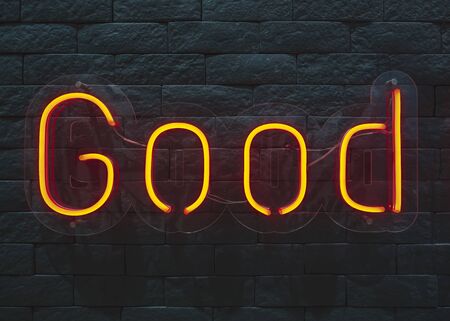 Neon sign Good type on Black wall textureの写真素材