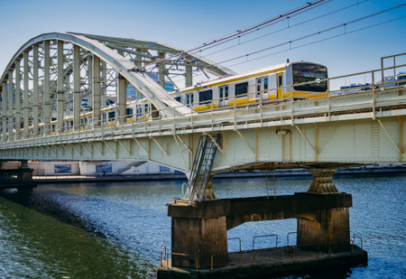 TOKYO, JAPAN - APR 13, 2019 : JR Sobu Train on bridge Tokyo city Japan Transportation Travelのeditorial素材
