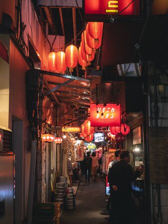 TOKYO, JAPAN - APR 21, 2019 : Night life Restaurant Bar street shop sign with salary man Japanese lifestyle Izakayaのeditorial素材