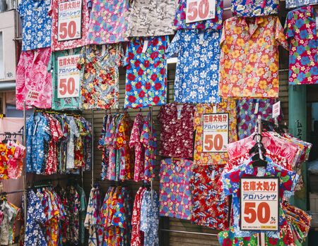OKINAWA, JAPAN - AUG 30, 2019 : Okinawa fashion clothing Hawaii T shirt shop display. Colourful fabric pattern Okinawa lifestyleのeditorial素材