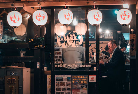 TOKYO, JAPAN - APR 11,2019 People drinking in Bar beer Local restaurant Japanese Salaryman Tokyo city Japan nightlifeのeditorial素材