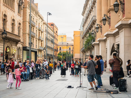 SPAIN, BARCELONA - OCT 11, 2018 : Shopping street with Music performance outdoor People lifestyle in...