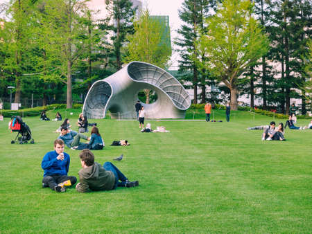 TOKYO, JAPAN - APR 20, 2019 : Park outdoor lifestyle green space with sculpture. People activity at Tokyo midtown Japanのeditorial素材