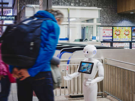 KANAZAWA, JAPAN - APR 11, 2017 : Pepper Robot Humanoid Artificial intelligence technology. Assistant with Information screen speak with tourist Japan Train stationのeditorial素材