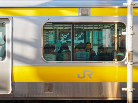 TOKYO, JAPAN - APR 20, 2019 : JR Sobu Train on Platform Station Tokyo city Japan Transportation...