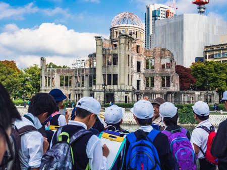 Hiroshima, Japan - November 3, 2015: Hiroshima Peace Memorial The Atomic Bomb Dome Group of student study history with tour guideのeditorial素材