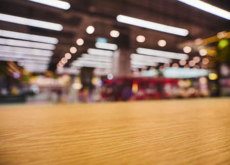 Table top counter with neon lighting Retail shop interior blur backgroundの写真素材