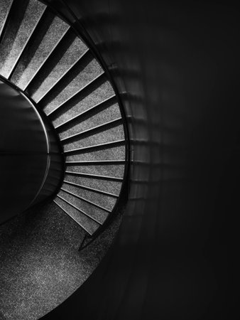 Spiral staircase on a dark background Black and whiteの写真素材