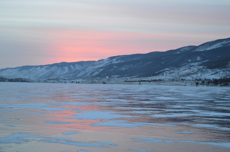 Beauty sunset, Baikal froze water lake, Russia winter seasonの写真素材