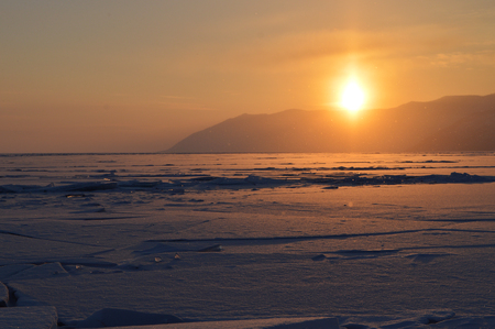 Beauty sunset, Baikal froze water lake, Russia winter seasonの写真素材