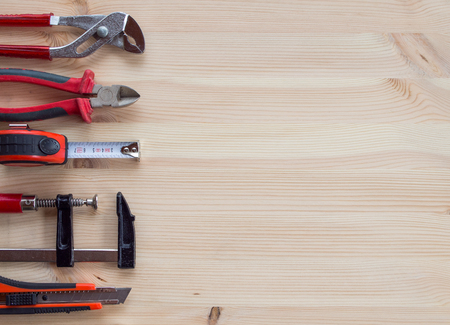 Hand tools isolated on a wooden background. Copy space.の写真素材