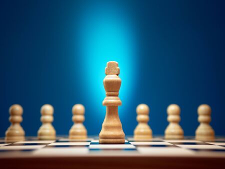 Leadership and strength concept, king leading his pawns.の写真素材