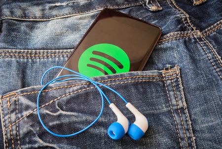 Zlin, Czech Republic - June 3, 2020: Smartphone screen with Spotify music streaming application...