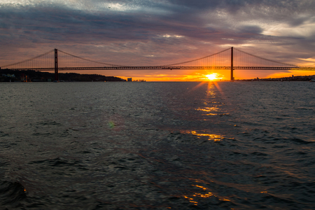 Tagus River, Bridge April 25 Lisbon at sunset, Portugalの写真素材