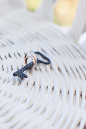 Wedding rings and  decoration on a white tableの写真素材