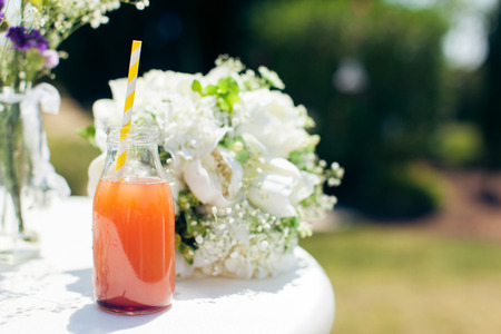 bottle of juice for  white wedding bouquetの写真素材