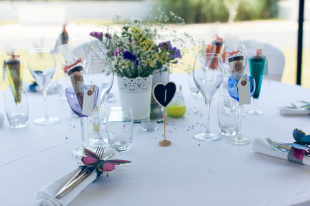 Beautifully served and designed white wedding tableの写真素材