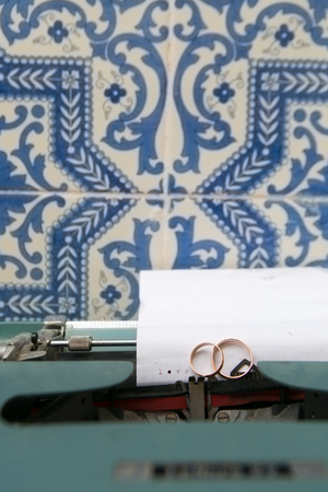 Wedding rings on a vintage typewriterの写真素材