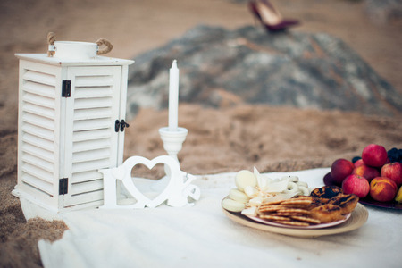 Romantic picnic on the beach with word Love close-upの写真素材